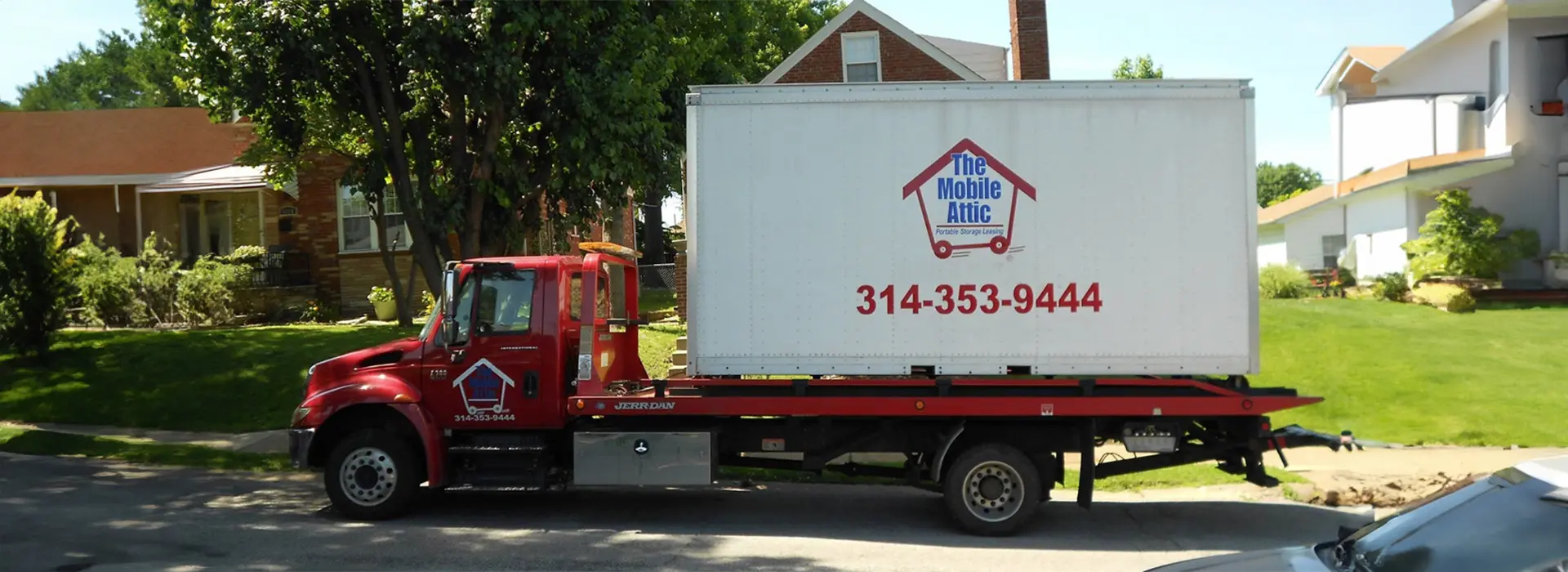 a truck transports a mobile storage unit